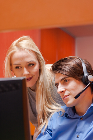 Portrait of call center agent at work in box officeの写真素材