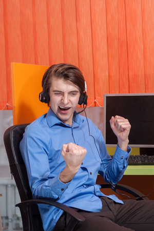 Portrait of call center agent at work in box officeの写真素材