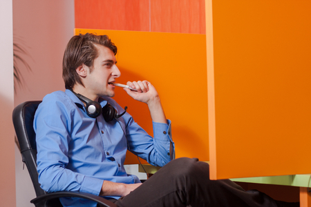 Portrait of call center agent at work in box officeの写真素材