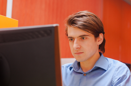 Portrait of call center agent at work in box officeの写真素材