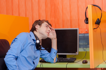 Portrait of call center agent at work in box officeの写真素材