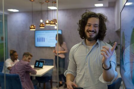 Young entrepreneurs are brainstorming ideas and working together in modern work environment.の写真素材