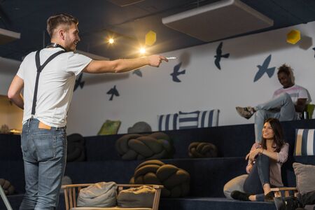 Young entrepreneurs are brainstorming ideas and working together in modern work environment.の写真素材