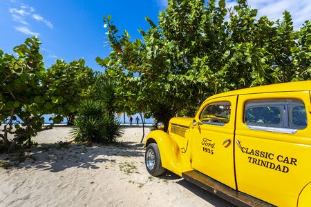 Trinidad, cuba - March 29 2019: Vinage car taxi next to the beach in Trinidad, UNESCO World Heritage Site,Trinidad, Cuba, West Indies, Caribbean, Central Americaのeditorial素材