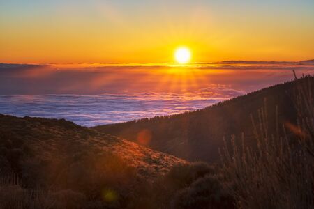 Spectacular sunset above the clouds in the Teide volcano national park in Europe, Spain, Canary Islands, Tenerifeの写真素材