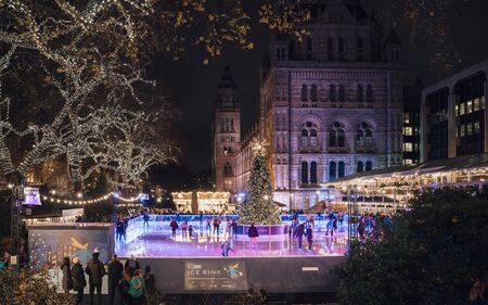 London, United Kingdon - Deceber 2 2018: Christmas tree and ice skating rink at night outside the Natural History Museum, Kensington, London, England, United Kingdom, Europeのeditorial素材