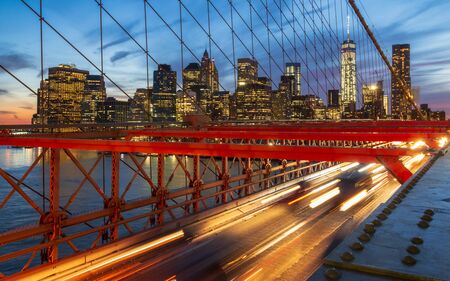 Manhattan skyline from the Brooklyn Bridge at night, New York, United States of America, North Americaの写真素材