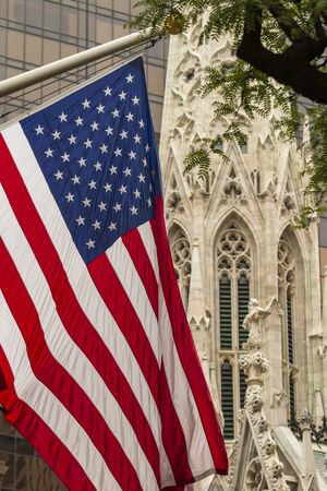 USA flag and St. Bartholomews Church, New York, United States of America, North Americaの写真素材