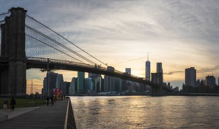 New York, USA - May 19 2015: Brooklyn Bridge, East River, Lower Manhattan skyline, New York skyline at sunset, New York City, United States of America, North Americaのeditorial素材
