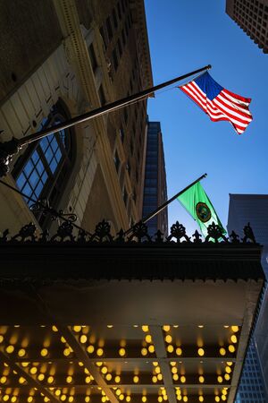Seattle, USA - September 28 2017: United States of America and Washington State flag waving in the air. Seattle downtown, Washington, USAのeditorial素材