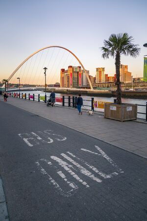 Newcastle, England - June 27 2018: Gateshead Millennium Bridge over River Tyne, Newcastle-upon-Tyne, Tyne and Wear, Tyneside, England, United Kingdom, Europeのeditorial素材