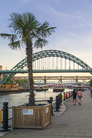 Newcastle, England - June 27 2018: Newcastle upon Tyne skyline, Gateshead with the Tyne Bridge over River Tyne, Tyne and Wear, Tyneside, England, United Kingdom, Europeのeditorial素材