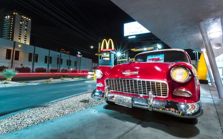 Las Vegas, USA - May 24 2018: Red Vintage Chevrolet on The Strip at night, Las Vegas Boulevard, Las Vegas, Nevada, USA, North Americaのeditorial素材