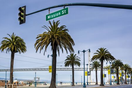 San Francisco, USA - June 9 2018: Oakland Bay Bridge and Palm Trees, San Francisco, California, United States of America, North Americaのeditorial素材