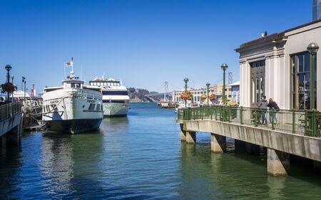 San Francisco, USA - June 8 2018: Pier 1 and Oukland Bay Bridge, San Francisco, California, United States of America, North Americaのeditorial素材