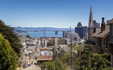 San Francisco, USA - June 11 2018: Street view of Transamerica Pyramid and Oakland Bay bridge San Francisco, California, USA, North Americaのeditorial素材