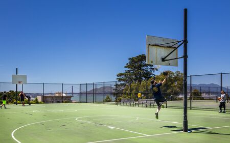 San Francisco, USA - June 11 2018: Basketball court with Golden Gate Bridge in the background, San Francisco, California, USA, North Americaのeditorial素材