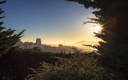 Foggy Sunset over Golden Gate Bridge from Coit Tower, San Francisco, California, United States of America, USAの写真素材