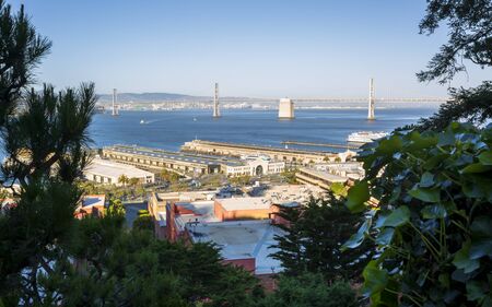 San Francisco, USA - June 12 2018: Oakland Bay Bridge and Fishermans Wharf, San Francisco, California, United States of America, USAのeditorial素材