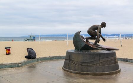 Los Angeles, USA - May 31 2018: Surfer statuete at Hermosa Beach, California, United States of America, North Americaのeditorial素材