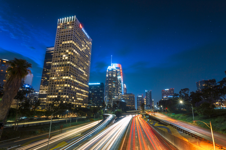 Downtown financial district of Los Angeles city and busy freeway at night, California, United States of America, North Americavのeditorial素材