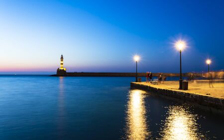 Crete, Greece - April 23 2018: Lighthouse at Venetian port at night, Chania, Crete, Greek Islands, Greece Europeのeditorial素材