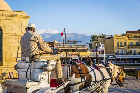 Crete, Greece - April 23 2018: Horse Carriage, Mosque, Venetian Harbour Chania Crete Greece Europeのeditorial素材