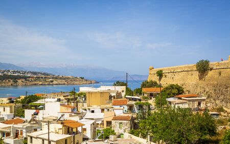 Crete, Greece - April 26 2018: Fortezza castle wall and Rethymnon old town, Crete, Greek Islands, Greece, Europeのeditorial素材