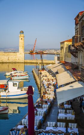 Crete, Greece - April 26 2018: Lighthouse at old Venetian harbour, Rethymno (Rethymnon), Crete, Greek Islands, Greece Europeのeditorial素材