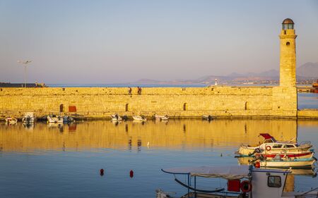 Crete, Greece - April 26 2018: Lighthouse at old Venetian harbour, Rethymno (Rethymnon), Crete, Greek Islands, Greece Europeのeditorial素材