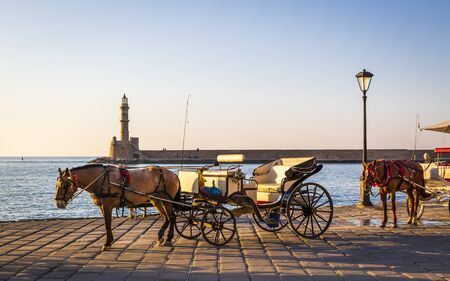 Crete, Greece - April 27 2018: A horse and cart for city tours, at the Venetian era harbour, at the Mediterranean port of Chania (Canea), Crete, Greek Islands, Greece, Europeのeditorial素材
