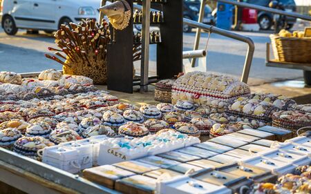 Crete, Greece - April 27 2018: Colourful souvenirs and sea shells for sale in Crete, Greek Islands, Greece, Europeのeditorial素材