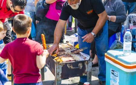 Man grilling kebab, Chania, Crete, Greek Islands Greece Europeのeditorial素材