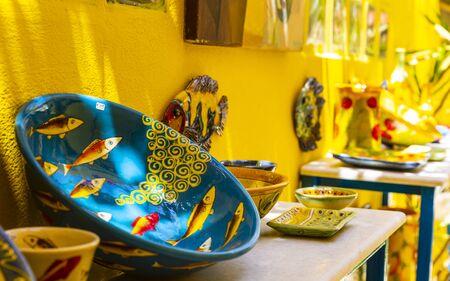 Colourful traditional Cretan pottery and souvenirs for sale in Crete, Greek Islands, Greece, Europeのeditorial素材