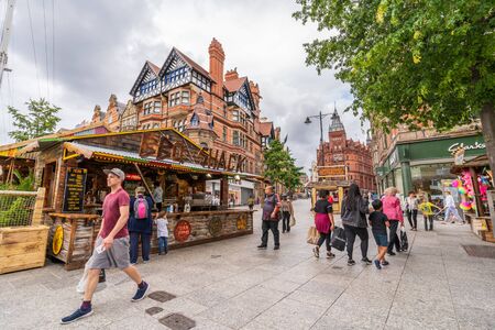 NOTTINGHAM, UK - AUGUST 07, 2019: Council House (City Hall) at Old Market Square with a pool, fountain, sand and beach chairs in the foreground.のeditorial素材