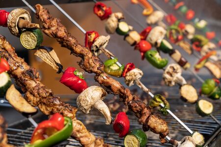Grilled vegetable and meat skewers in a herb marinade on a grill outside, Brisol harbor festivalのeditorial素材