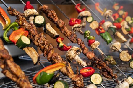 Grilled vegetable and meat skewers in a herb marinade on a grill outside, Brisol harbor festivalのeditorial素材