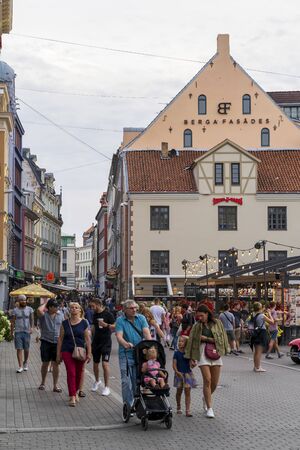 RIGA, LATVIA - AUGUST 16, 2019: Berga Fasade and Kalku Street, Old Town, UNESCO World Heritage Site, Riga, Latvia Europeのeditorial素材