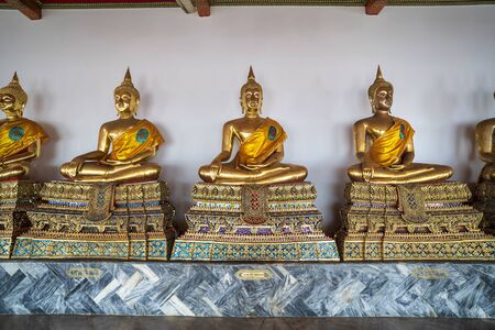 Bangkok, Thailand - January 5, 2020: Seated Golden Buddha statues in a row at Wat Phra Chetuphon (Wat Pho) temple, Bangkok, Thailand, Southeast Asia, Asiaのeditorial素材