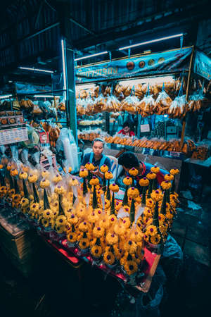 Bangkok, Thailand - December 18th 2019: Bangkok street market at night, food, flowers, Thailand, SouthEast Asiaのeditorial素材