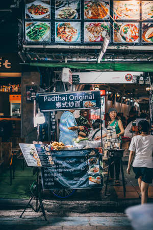 Bangkok, Thailand - December 18th 2019: Bangkok street market at night, food, flowers, Thailand, SouthEast Asiaのeditorial素材
