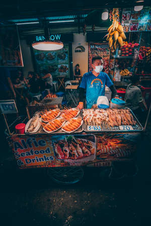Bangkok, Thailand - December 18th 2019: Bangkok street market at night, food, flowers, Thailand, SouthEast Asiaのeditorial素材