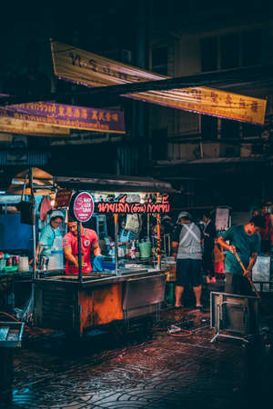 Bangkok, Thailand - December 18th 2019: Bangkok street market at night, food, flowers, Thailand, SouthEast Asiaのeditorial素材
