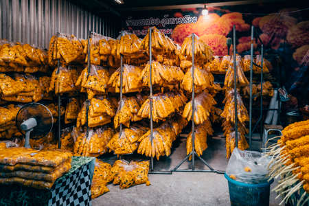 Bangkok, Thailand - December 18th 2019: Bangkok street market at night, food, flowers, Thailand, SouthEast Asiaのeditorial素材