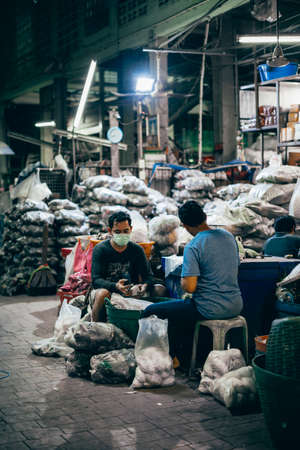 Bangkok, Thailand - December 18th 2019: Bangkok street market at night, food, flowers, Thailand, SouthEast Asiaのeditorial素材