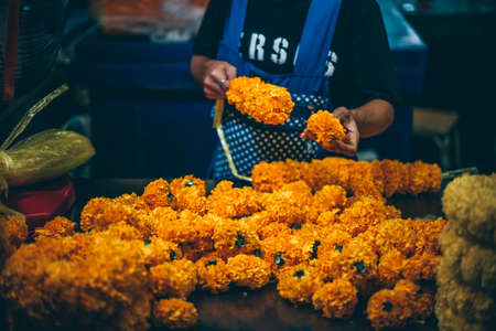 Bangkok, Thailand - December 18th 2019: Bangkok street market at night, food, flowers, Thailand, SouthEast Asiaのeditorial素材