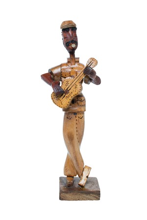 a wooden statue of a man with guitarの写真素材