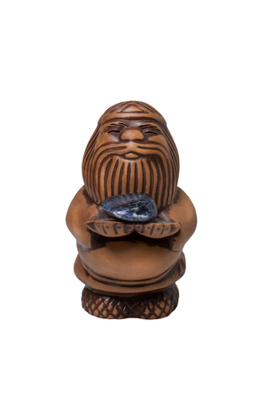 clay man with a stone on a white background