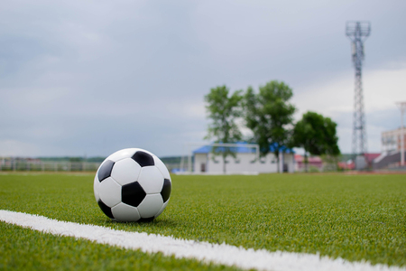 soccer ball with soccer goal on a green lawnの写真素材