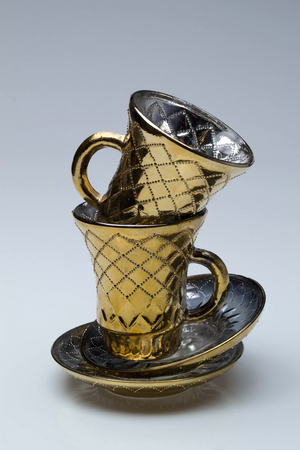 Vintage gold cup for tea and coffeeの写真素材